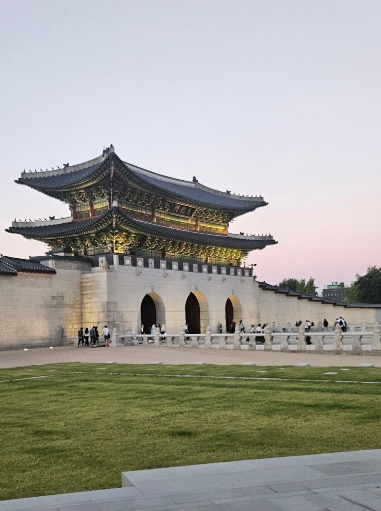 View of Gwanghwamun Gate taken from a moving rickshaw during a family tour in Seoul.