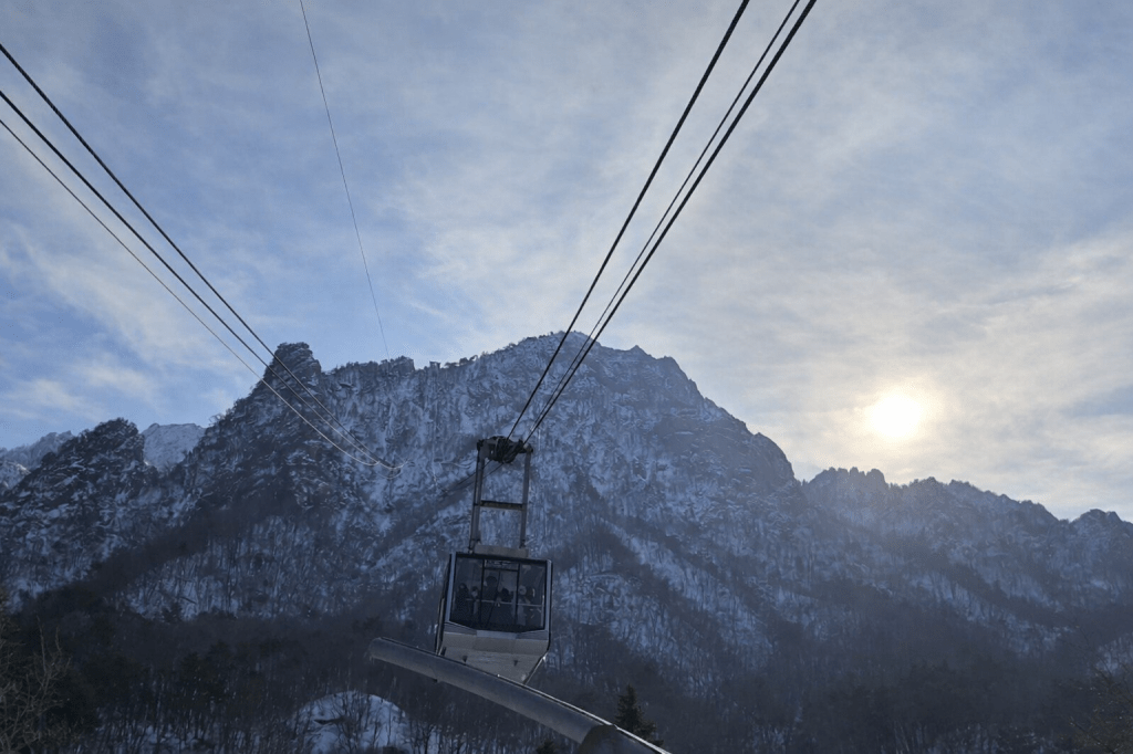 Seoraksan Cable Car rising toward snow-covered peaks, offering panoramic winter views of Seoraksan National Park in Gangwon-do, Korea