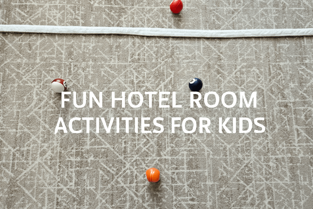 A simple hotel room activity where kids roll small balls toward a towel line on the floor.