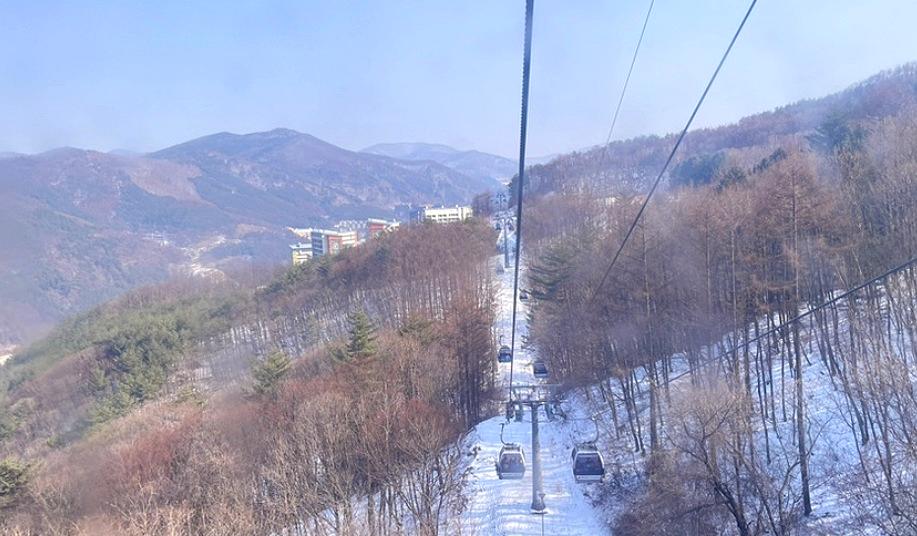 Gondola ride overlooking the snowy mountains at High1 Ski Resort in Gangwon, Korea