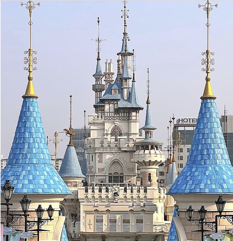 Lotte World Adventure in Seoul, featuring the iconic fairytale-style castle and blue-roofed towers.