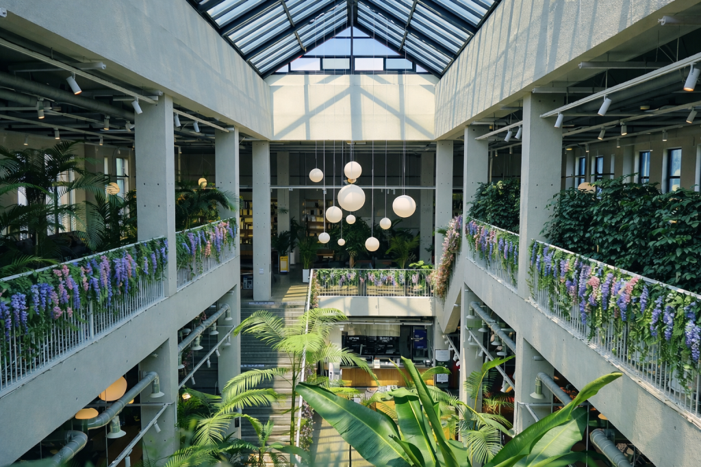 Greenhouse-style cafe near Seoul with plants, natural light, and modern architecture