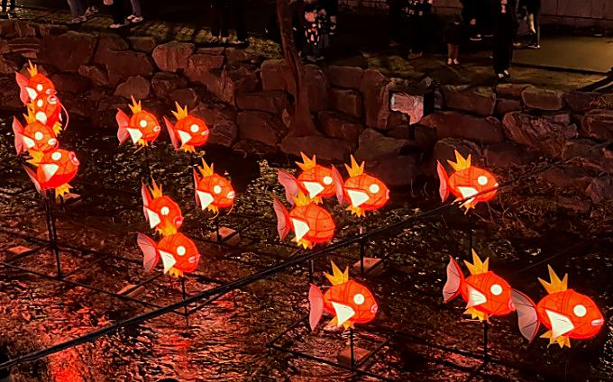 Magikarp lanterns glowing along Cheonggyecheon during the Seoul Lantern Festival, popular with children at night