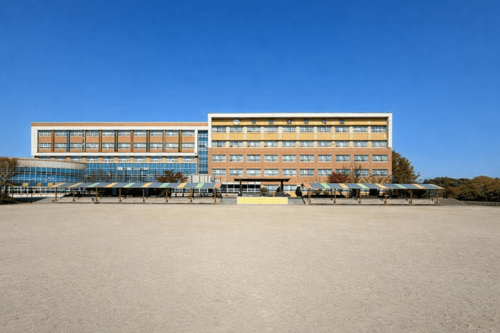 South Korean public elementary school building in early March under clear blue sky